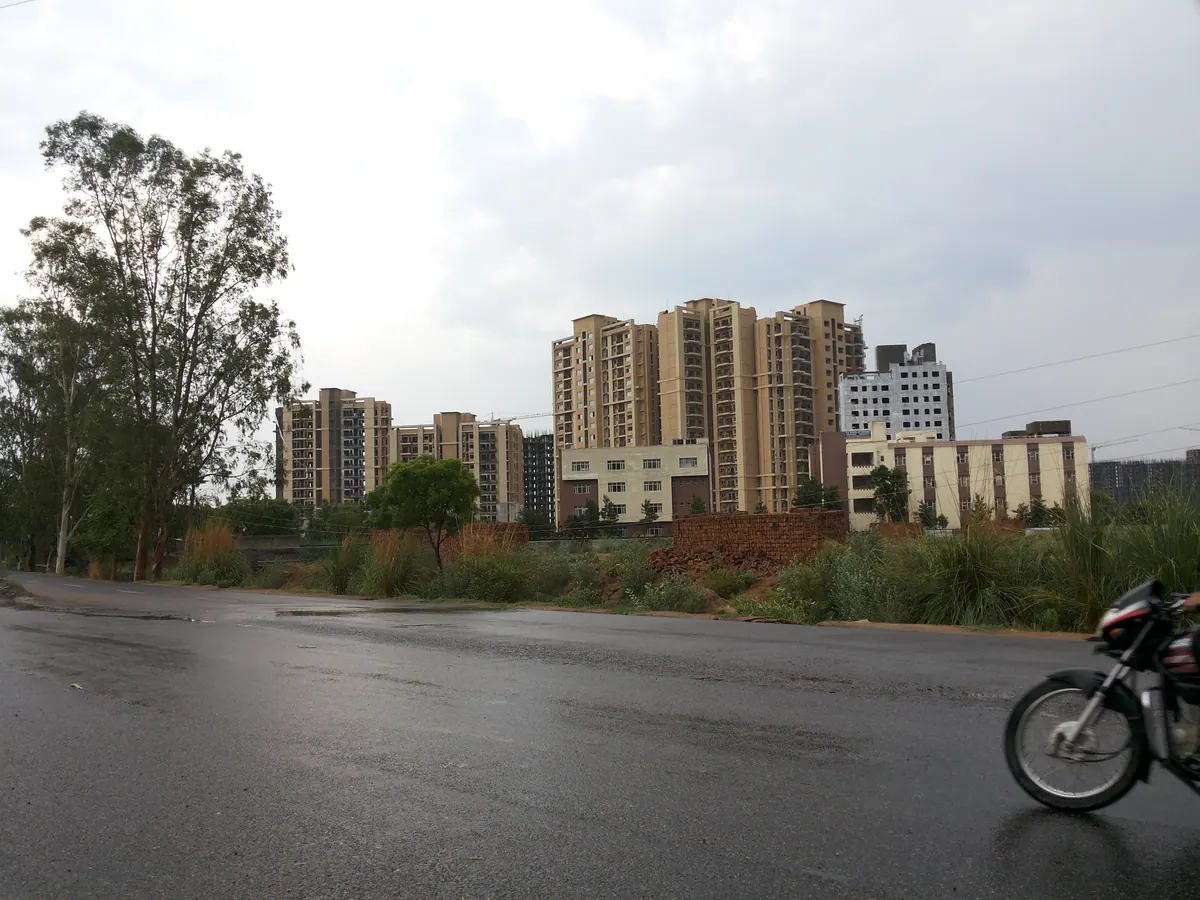 Real view of New Pataudi Road and surrounding residential development in Pataudi, Haryana